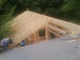 Framing a new roof addition that ties into an existing shingle roof in Pierpont